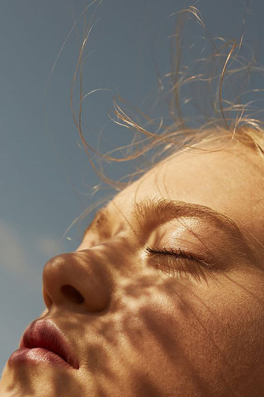 Girl with face in sunlight