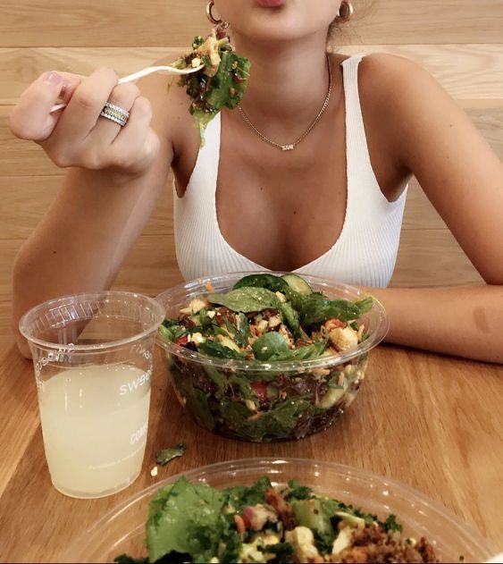 Girl eating healthy salad lunch